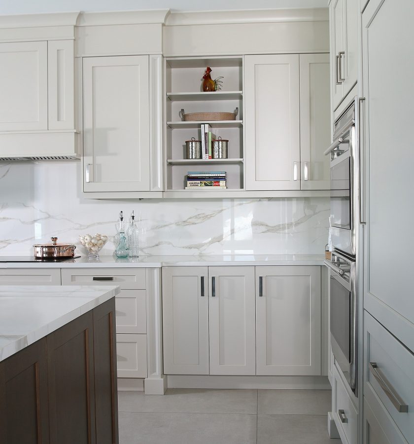 Modern white kitchen with dark brown island